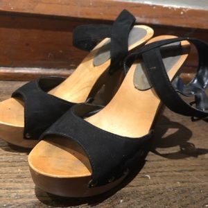 Black with wooden platform heels / sandals.
